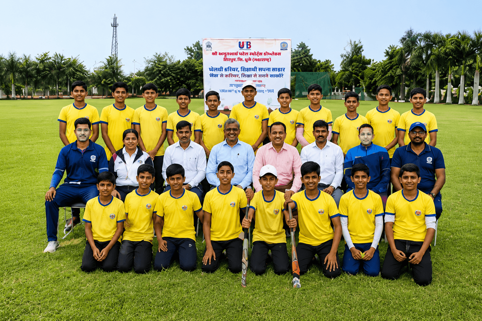 A youth cricket team photographed with Bhupeshbhai on the ground